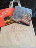 Bookish Bundle showing Ask Me About My TBR tee, Books Are My Love Language tee, and The Book Apothecarian Co tote bag