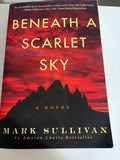 Beneath a Scarlet Sky by Mark Sullivan — paperback book cover